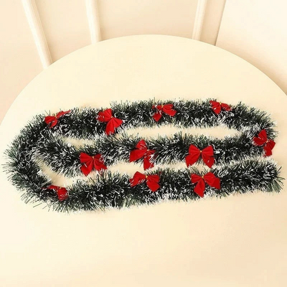 By Levin 2-meter green and white tinsel Christmas garland decorated with festive red bows for holiday home decor