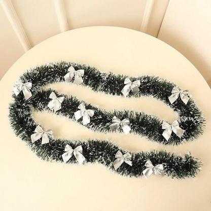 By Levin 2-meter green tinsel Christmas garland decorated with small silver bows for festive holiday home decor