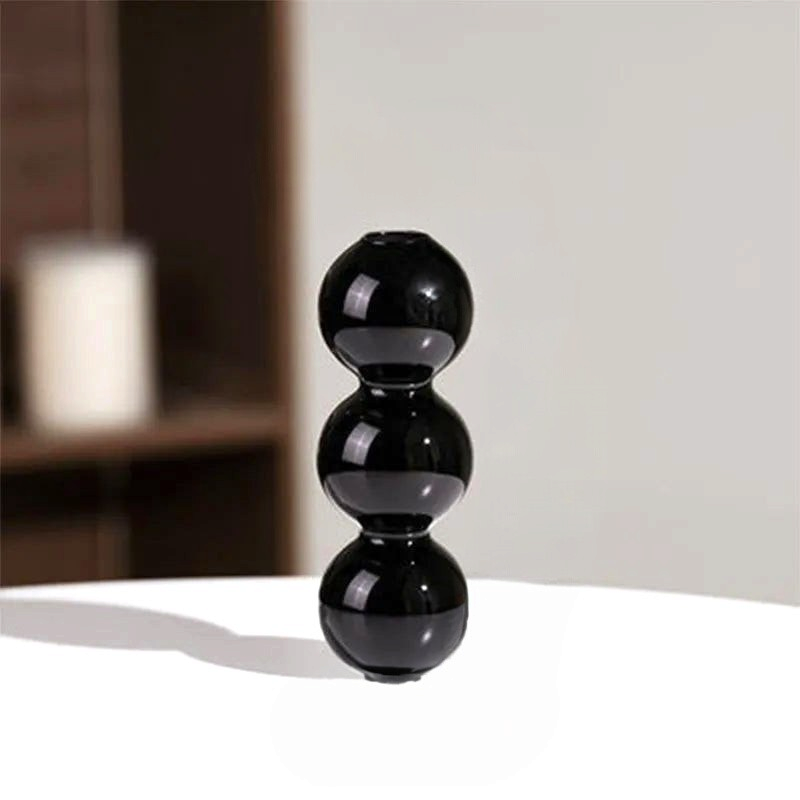 By Levin black Nordic bubble glass flower vase with a stacked sphere design for modern minimalist home decor.