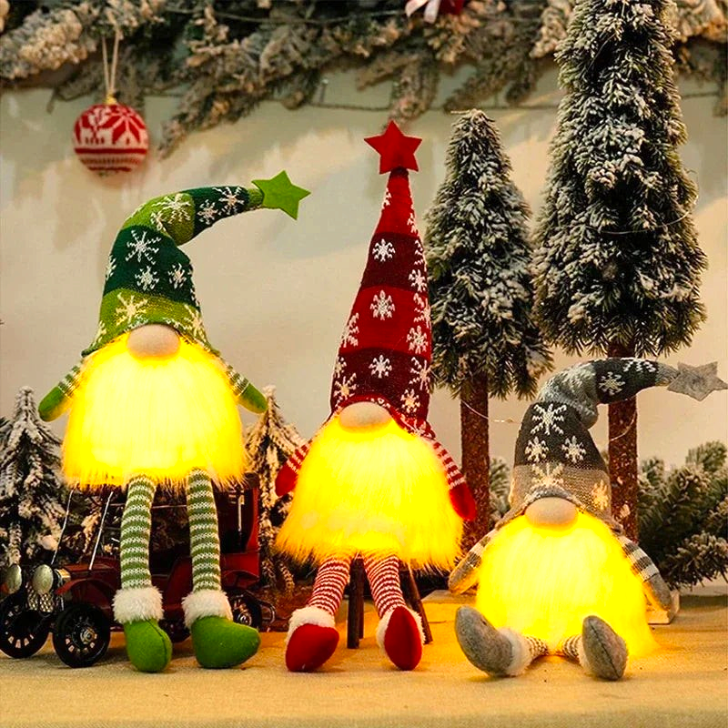 By Levin set of three illuminated Scandinavian Christmas gnomes with LED glowing beards and snowflake knit hats.