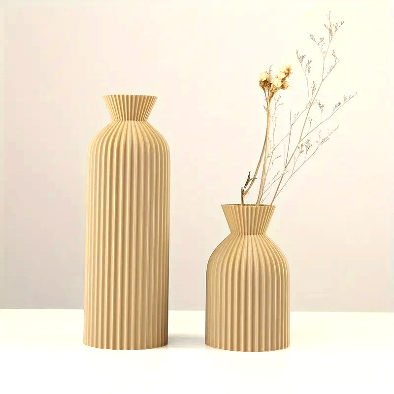 By Levin set of two khaki pleated plastic vases with a modern Nordic design, perfect for dried flowers.