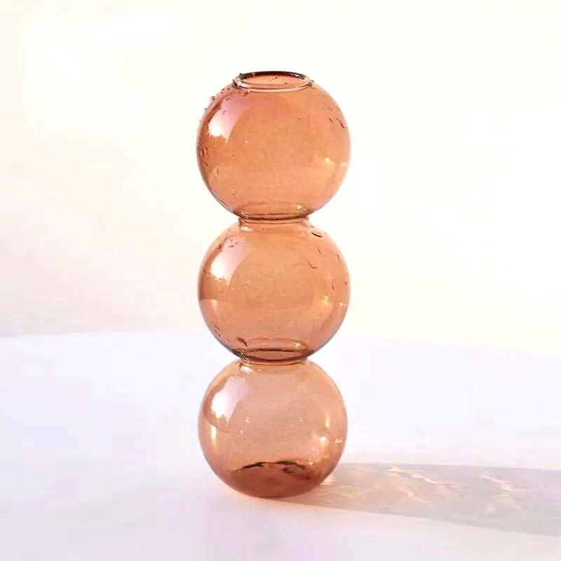 By Levin Nordic Bubble glass flower vase in a warm champagne tone with a stacked sphere design for modern decor.