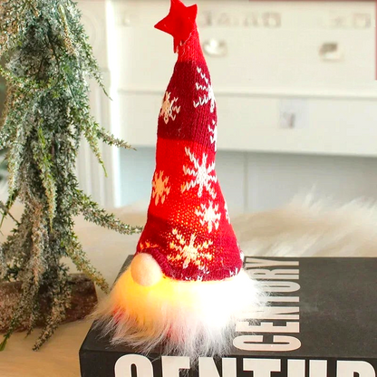 By Levin red LED Christmas gnome with a knitted snowflake hat and glowing warm white light in a festive setting