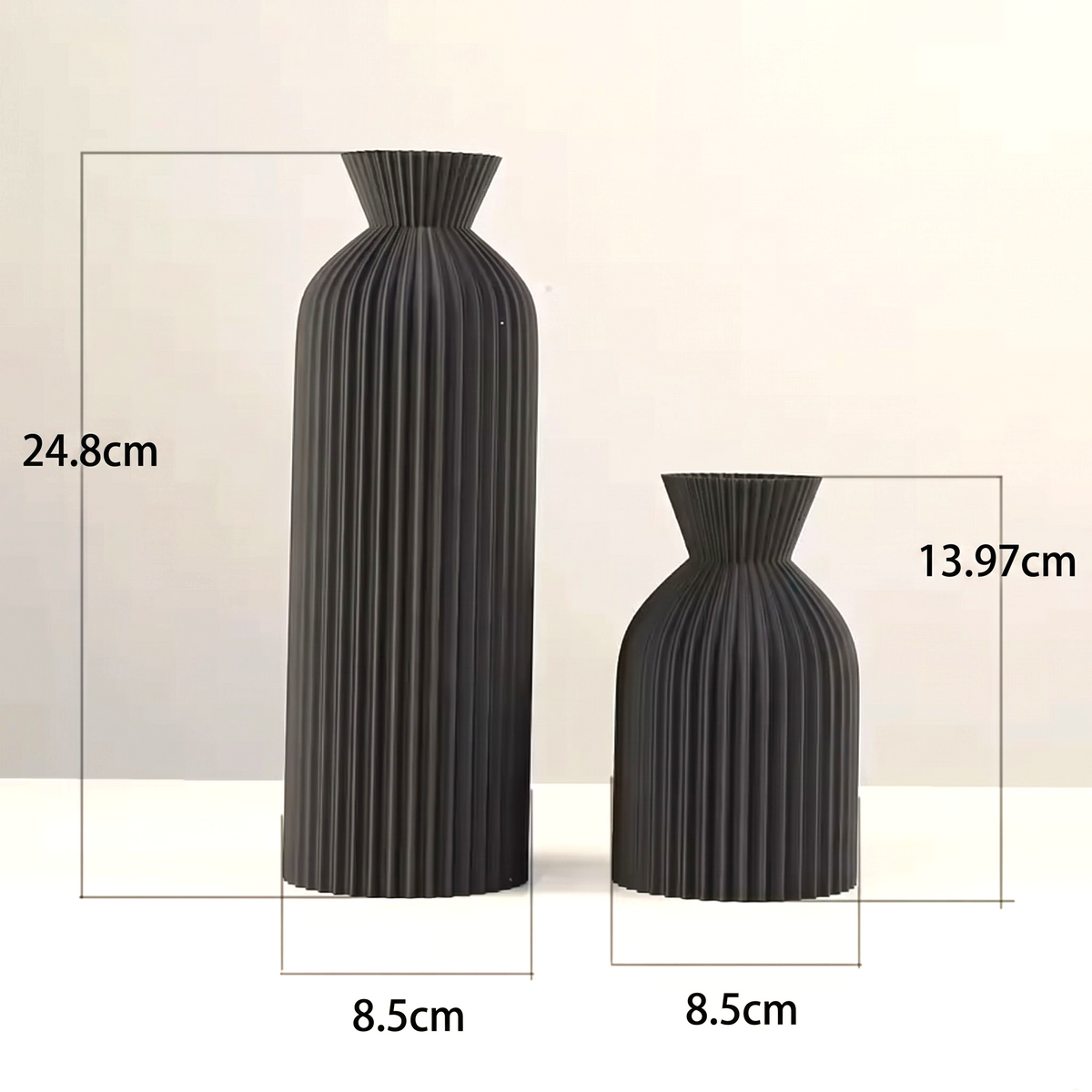 By Levin set of two black Nordic pleated plastic vases with vertical lines and flared rims for modern home decor.