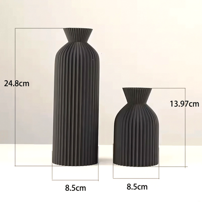 By Levin set of two black Nordic pleated plastic vases with vertical lines and flared rims for modern home decor.